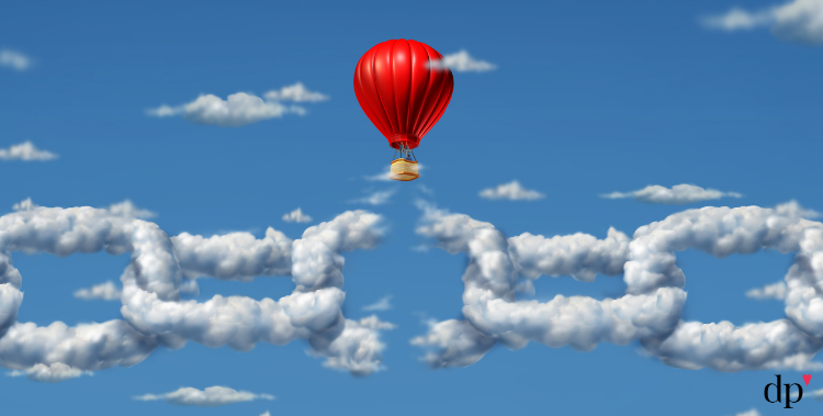 hot air balloon rising and breaking through a chain made of clouds