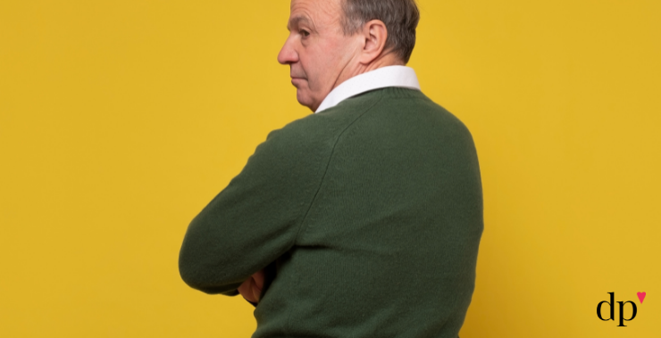 Disgruntled man looking over his shoulder